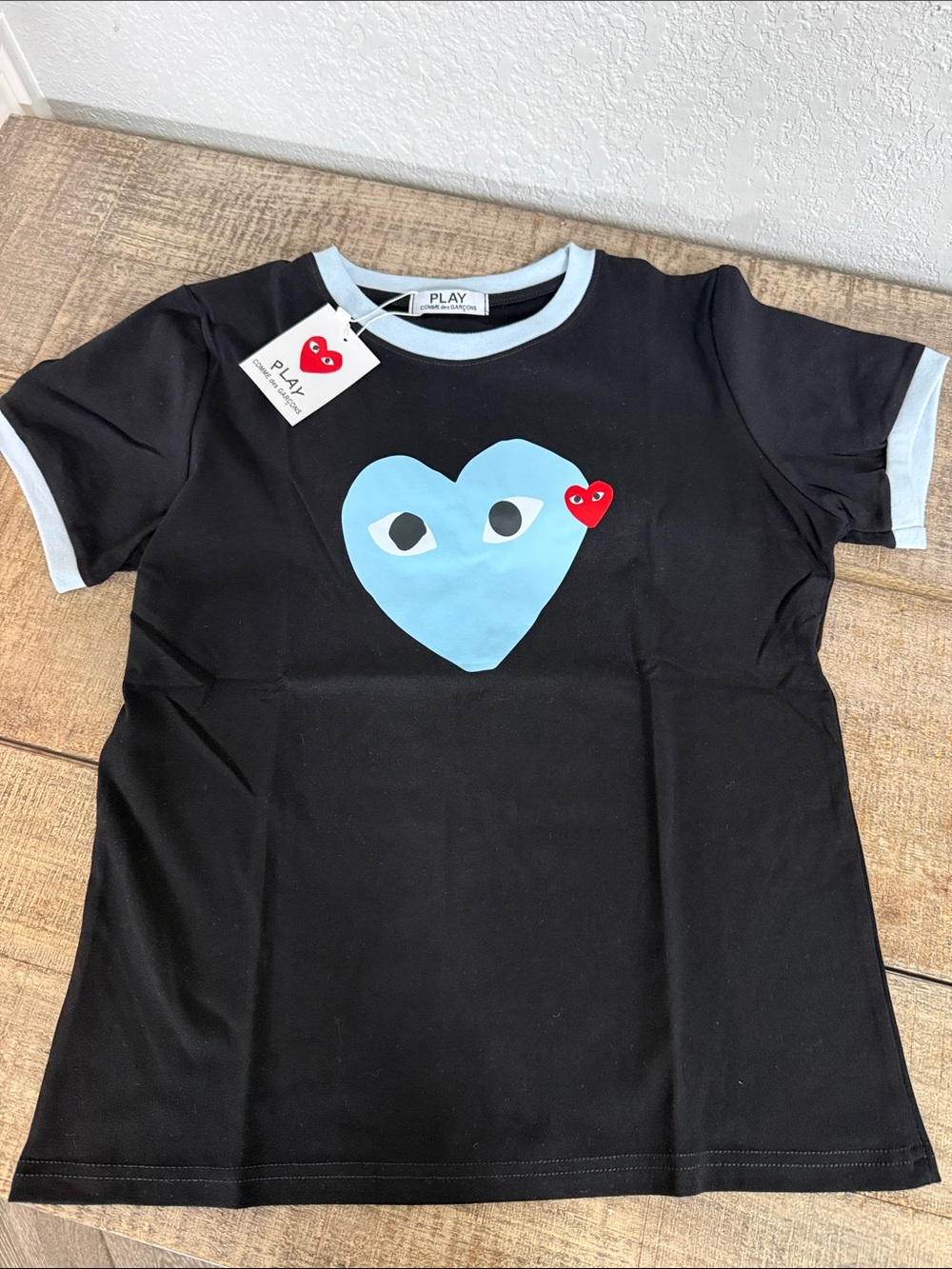 Women’s Black Stretch Short Sleeve Tee with Light Blue Heart and Red Accent